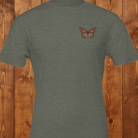 Load image into Gallery viewer, No. 26: Chrysalis to Flight - Flat lay of an olive green premium luxury tee featuring a vintage botanical butterfly chest graphic.
