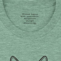 Load image into Gallery viewer, Interior collar detail of a premium luxury tee displaying the intentional inner work quote: 'Wisdom begins with observation. Perspective changes everything.