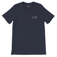 Load image into Gallery viewer, Heather Midnight Navy 1776 Patriot's Club shirt, front view: 1776 in white script on the left chest, plain sleeves.
