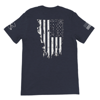 Load image into Gallery viewer, Heather Midnight Navy 1776 Patriot's Club shirt with sleeve graphics, back view: distressed American flag across the back, badges on both sleeves.
