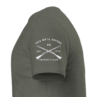 Load image into Gallery viewer, Left sleeve of the Heather Military Green 1776 Patriot's Club shirt: crossed muskets with This We'll Defend, US, Est. 1776 and Patriot's Club in white.
