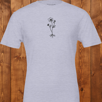 Load image into Gallery viewer, Women's premium sueded cotton graphic tee in Light Heather Grey. Features the 'Survival &amp; Beauty' botanical art in black. Comfortable, intentional everyday clothing.