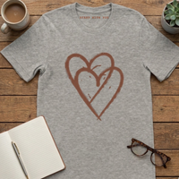 Load image into Gallery viewer, Heather Grey interlocking hearts t-shirt flat lay on wood surface.