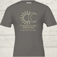 Load image into Gallery viewer, Flat lay of the Asphalt dark grey No. 15 Frequencies Matched premium luxury tee with a minimalist gold sun and moon design.