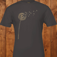 Load image into Gallery viewer, No. 25: The Emergence - Flat lay of a dark grey premium luxury tee featuring a scattering dandelion illustration
