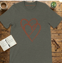 Load image into Gallery viewer, Dark Grey Heather t-shirt with heart graphic flat lay with journal.