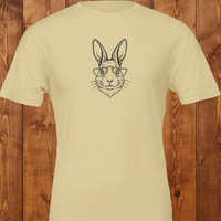 Load image into Gallery viewer, Flat lay of a tan premium ring-spun cotton luxury tee featuring a crisp, minimalist rabbit line-art design."