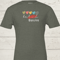 Load image into Gallery viewer, Bella and Canvas Heather Military Green graphic tee featuring red scratch over 'Be Kind' text and distressed 'Genuine' logo."