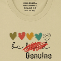 Load image into Gallery viewer, Beige t-shirt with colorful hearts and motivational quote on a plain background. Inner neck label detail reading Kindness is a Performance, Genuine is a Discipline.