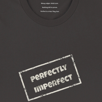 Load image into Gallery viewer, Black t-shirt with 'PERFECTLY IMPERFECT' text and secret collar message on a dark background