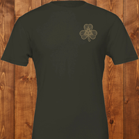 Load image into Gallery viewer, Flatlay of a deep forest green t-shirt featuring an elevated, premium gold Celtic knot shamrock design on the left chest.