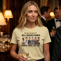 Load image into Gallery viewer, A woman in her late twenties holding a glass of white wine at an evening social gathering, wearing the cream No. 32 Well-Behaved Women t-shirt.