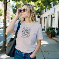 Load image into Gallery viewer, All Is Well shirt in Soft Pink — street lifestyle, model in sunglasses