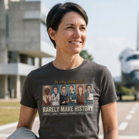 Load image into Gallery viewer, Cinematic lifestyle photography of a female astronaut in motion, wearing a dark charcoal premium graphic tee that acts as a boundary-setting uniform for the modern advocate