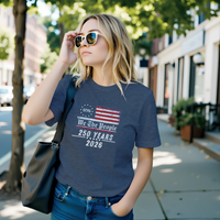 Load image into Gallery viewer, Young woman confidently wearing the authentic heritage We The People 250 Years graphic tee in Heather Navy on a sunlit street, acting as a wearable identity flag for the modern minimalist.