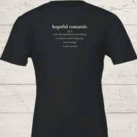 Load image into Gallery viewer, Women's premium sueded cotton graphic tee in Black. Features the white 'Hopeful Romantic' typography. Quiet luxury aesthetic with a gritty edge.