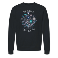 Load image into Gallery viewer, Black Be Still and Know crewneck sweatshirt laid flat, showing the wildflower bouquet with "Be Still" above and "And Know" below in off-white lettering.
