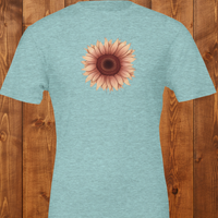 Load image into Gallery viewer, Flatlay of the No. 28 The Evolution Premium Luxury Tee in Heather Ice Blue, highlighting the premium ring-spun cotton blend and vintage botanical art.