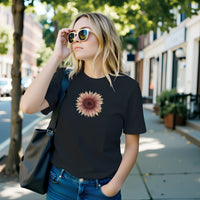 Load image into Gallery viewer, A blonde woman in sunglasses on a city street wearing the No. 28 The Evolution Premium Luxury Tee in True Black.