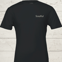 Load image into Gallery viewer, Women's premium sueded cotton graphic tee in Black. Features minimalist 'Soulful' chest typography. Part of the 'Inner Anchor' study for emotional resilience.