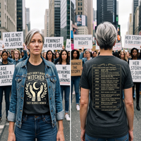 Load image into Gallery viewer, Urban street lifestyle portrait of a confident matriarch styling a charcoal heather grey premium side-seamed tee layered under denim, serving as an unapologetic identity flag for equality and female empowerment.