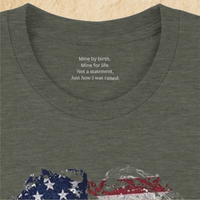 Load image into Gallery viewer, Close-up of the inner collar on the Heather Military Green Deep Roots, Steady Heart shirt, showing the hidden message: Mine by birth. Mine for life. Not a statement, just how I was raised.