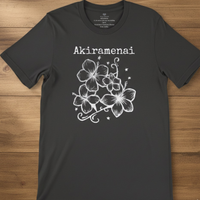 Load image into Gallery viewer, Charcoal dark grey Akiramenai t-shirt flat lay showing the full front white hibiscus flower design and text.