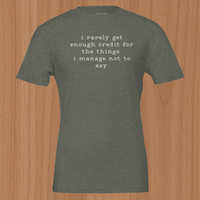 Load image into Gallery viewer, Flat lay mockup of the No 29 Unspoken Word premium sueded cotton tee in olive green.