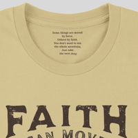 Load image into Gallery viewer, Close-up of the inner collar on the Soft Cream Faith Can Move Mountains shirt, reading "Some things are moved by force. Others by faith. You don't need to see the whole mountain. Just take the next step."