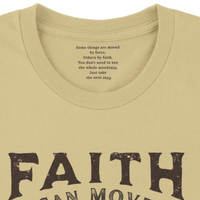 Load image into Gallery viewer, Macro detail of the distressed FAITH lettering and mountain graphic on the Warm Cream Faith can Move Mountains shirt.