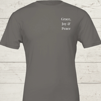 Load image into Gallery viewer, Flat product shot of the Grace, Joy &amp; Peace shirt in Charcoal Grey, featuring minimalist 'Grace, Joy &amp; Peace' left chest typography.
