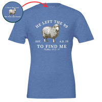 Load image into Gallery viewer, Heather Columbia Blue He Left the 99 to Find Me shirt, flat front view showing the engraved sheep with "He left the 99" arched above, "To find me" and Matthew 18:12-14 below, with an inset close-up of the inner collar message.
