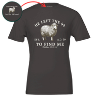 Load image into Gallery viewer, Vintage Black He Left the 99 to Find Me shirt, flat front view showing the engraved sheep with "He left the 99" arched above, "To find me" and Matthew 18:12-14 below, with an inset close-up of the inner collar message.
