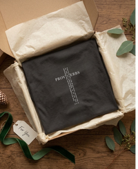 Load image into Gallery viewer, Folded Vintage Black He Will Straighten Your Path shirt displayed in an open kraft gift box with tissue paper and ribbon.