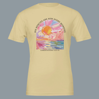 Load image into Gallery viewer, Studio shot of the Soft Cream His Mercies Are New Every Morning shirt, front graphic showing a painted sunrise arch with Lamentations 3:22-23.