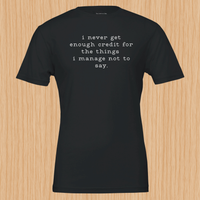 Load image into Gallery viewer, I never get enough credit shirt in Black — front flat lay, artisanal print side-seamed tee