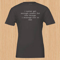 Load image into Gallery viewer, I never get enough credit shirt in Vintage Black — front flat lay, lowercase typewriter serif print