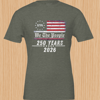 Load image into Gallery viewer, Clean studio product shot of the vintage distressed American flag graphic shirt in Heather Military Green, emphasizing the premium heritage quality and inclusive 1776 patriotic apparel design.