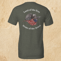 Load image into Gallery viewer, Back flat lay of the Land of the Free, Home of the Brave shirt in Heather Military Green, featuring an eagle gripping a spear-mounted flag with ‘Land of the Free’ and ‘Home of the Brave’ arched in Alabaster ink.