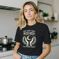 Load image into Gallery viewer, Relatable modern home lifestyle portrait emphasizing a dark premium luxury graphic tee as an elevated, comfortable foundation piece for the uncompromising modern woman.