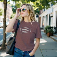 Load image into Gallery viewer, Alternate outdoor lifestyle shot of a woman in the dark heather perfectly imperfect grunge tee