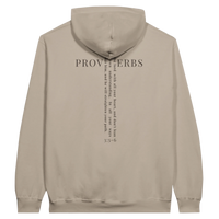 Load image into Gallery viewer, Cement Proverbs 3:5-6 hooded sweatshirt, flat back view showing PROVERBS in serif capitals with the verse set vertically through the lettering to form a cross, and 3:5-6 beneath.

