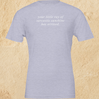Load image into Gallery viewer, Flat lay of the heather blue Your Little Ray of Sarcastic Sunshine Has Arrived premium graphic tee — Alabaster artisanal print by Vital Threads.