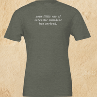 Load image into Gallery viewer, Flat lay of the heather military green Your Little Ray of Sarcastic Sunshine Has Arrived premium graphic tee — two-pass artisanal print by Vital Threads.