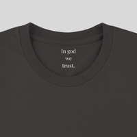 Load image into Gallery viewer, Close-up of the inner collar on the Vintage Black Trust In Him shirt, reading "In god we trust."