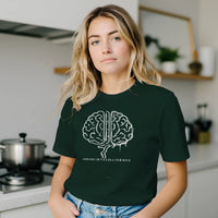 Load image into Gallery viewer, Blonde woman standing in a modern kitchen wearing the Dark Forest Green No. 05 Symbiosis premium luxury tee.