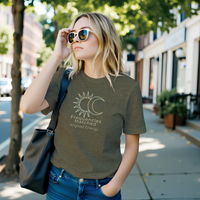 Load image into Gallery viewer, Blonde woman walking on a city street modeling the Heather Olive green No. 15 Frequencies Matched premium luxury tee by Vital Threads.