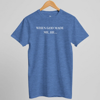 Load image into Gallery viewer, Studio hanger shot of the When God Made Me shirt in Heather Columbia Blue, front "When God Made Me, He..." text visible.